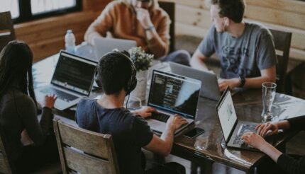 This is a picture of a happy team to demonstrate reating a Culture of Growth – How to Empower Your Team